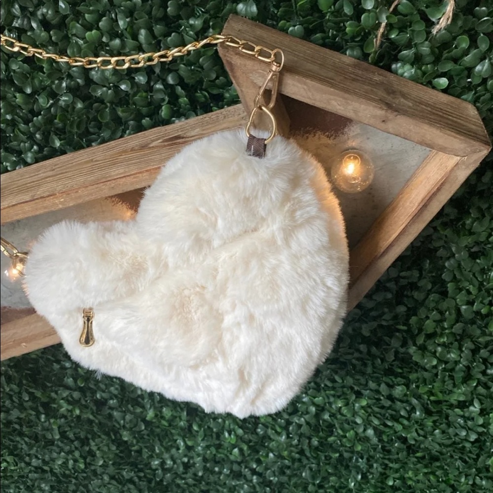 Faux fur crossbody purse. Available in gray, red,